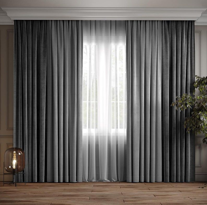 Large bedroom window with elegant curtains in a luxury bedroom interior